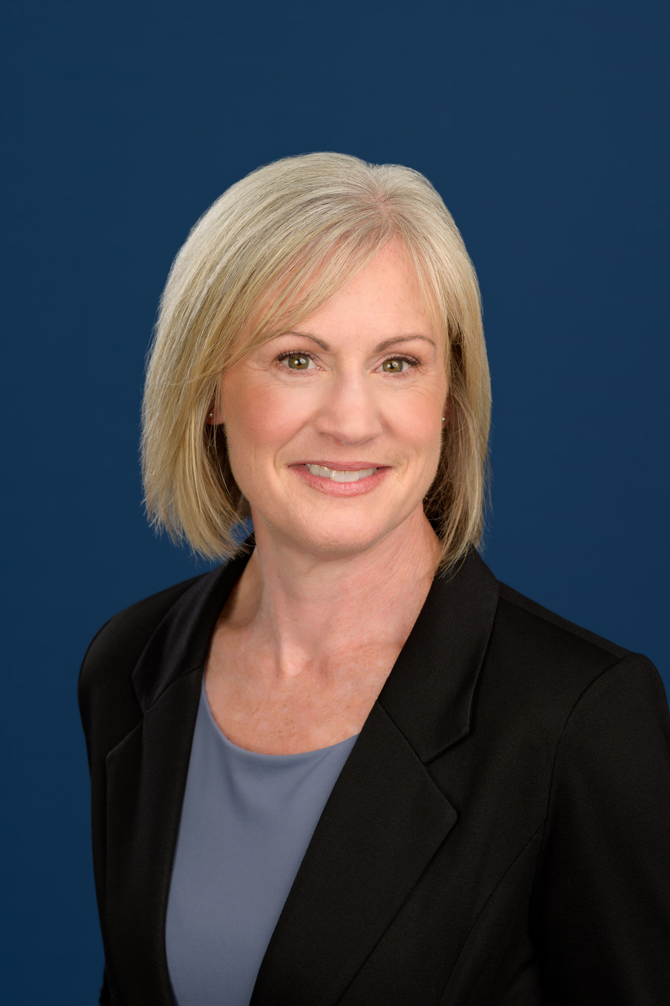 Halifax headshot photography of woman on blue background
